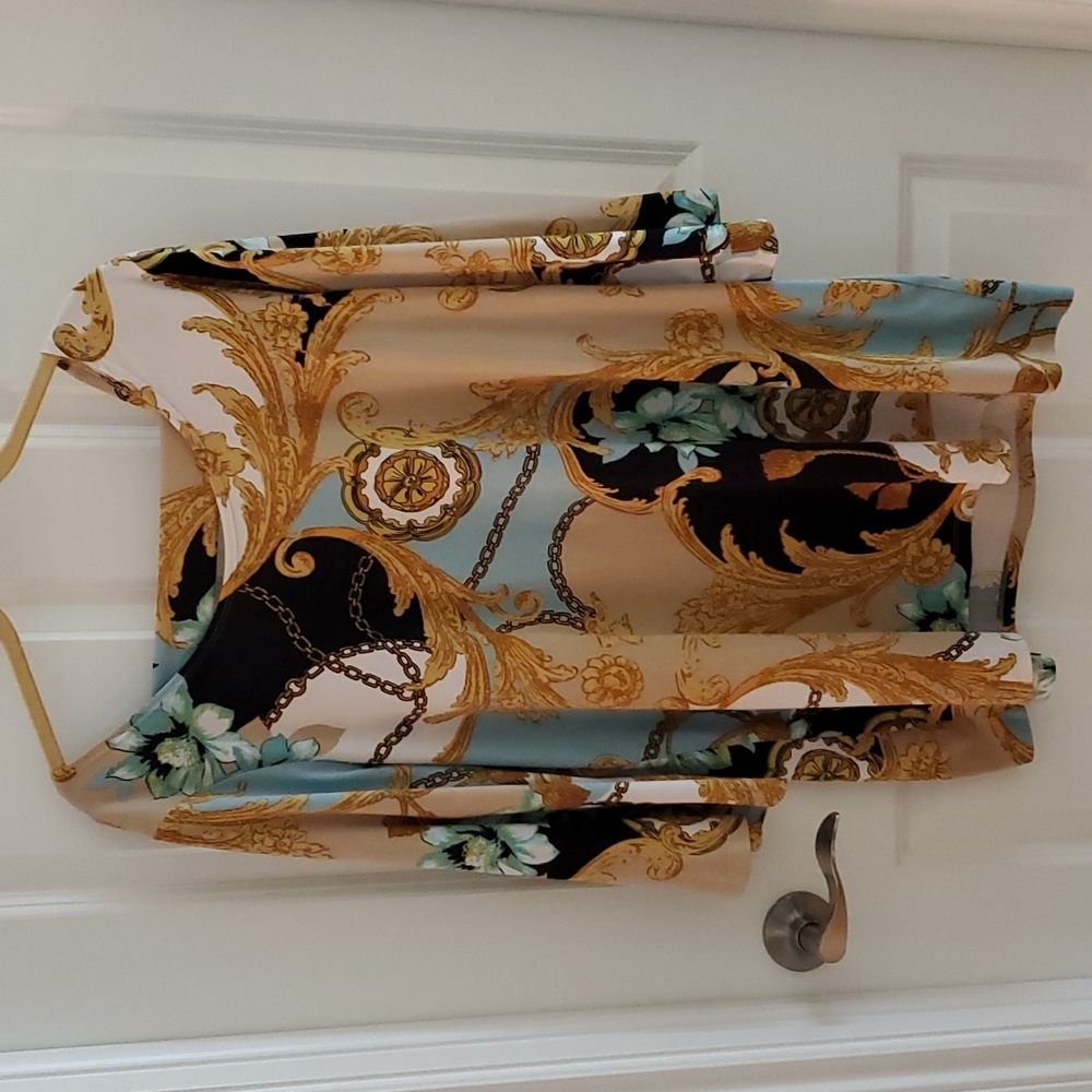 Beautiful top...perfect for an evening out! Wrinkle free. Perfect for traveling.